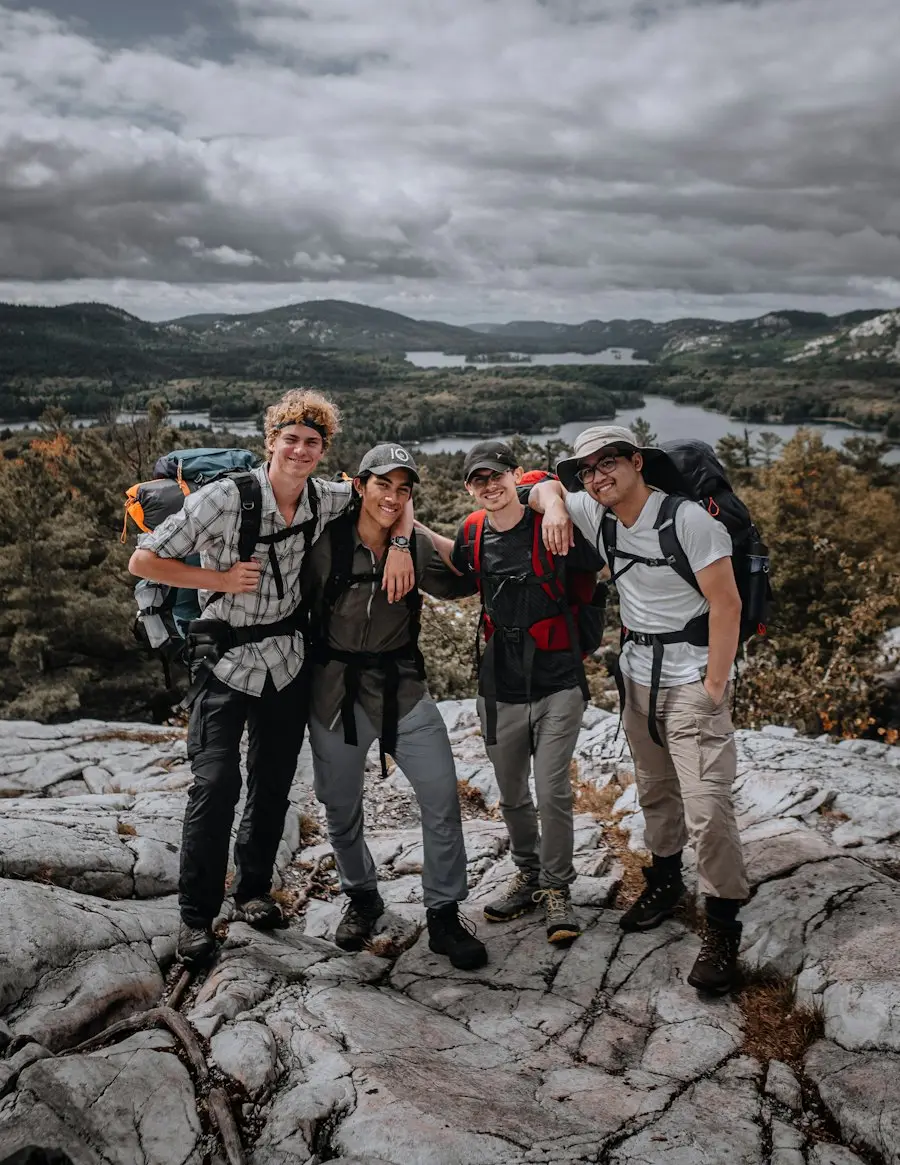 A group of friends gathering at a trailhead