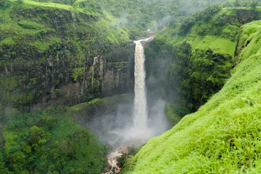 Waterfall in a green Western Ghats valley on the Kalsubai Peak route